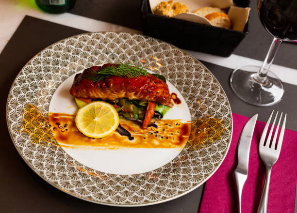 istock Salmon in soy-honey sauce with fried vegetables 1358614327