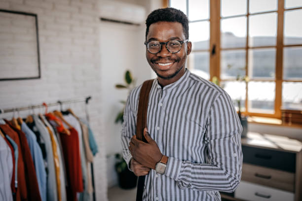 istock Happy man wearing backpack at home leaving for work 1358615257