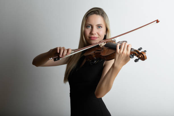 istock Woman playing the violin 1358615739