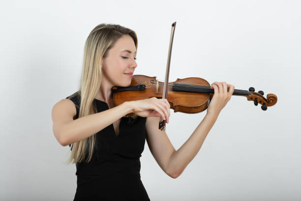 istock Woman playing the violin 1358615779