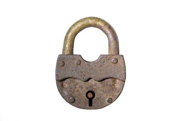 istock Old padlock with closed shackle and rusty surface. The isolated image on a white background. Vintage. Texture. 1358620874