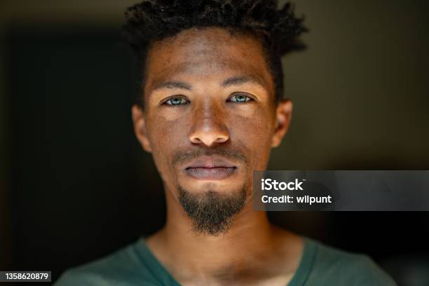 Close Up Headshot Portrait Of Young Mixed Race Male Face With Green Eyes Facial Hair And Rasta Hair Stock Photo - Download Image Now