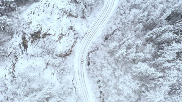 istock Car driving on winter country road 1358622208