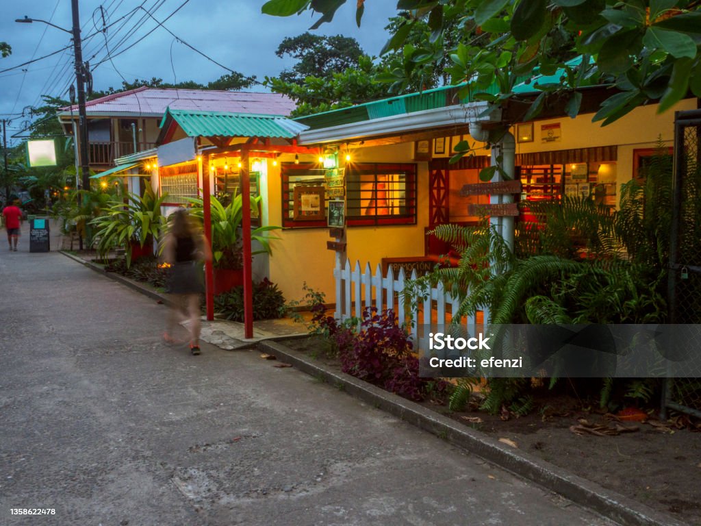 Street in Tortuguero in Costa Rica The evening view of a street in Tortuguero - a village on the Northern Caribbean coast of Costa Rica in the Limón Province, which can be reached only by boat or airplane. Tortuguero Stock Photo