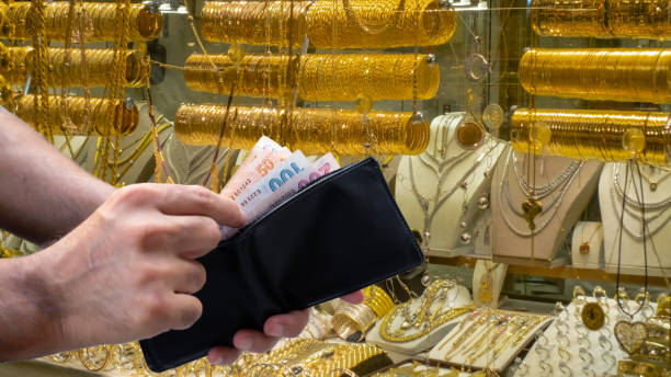 male hand taking money out of wallet male hand taking money out of wallet in jewelery shop devaluation stock pictures, royalty-free photos & images