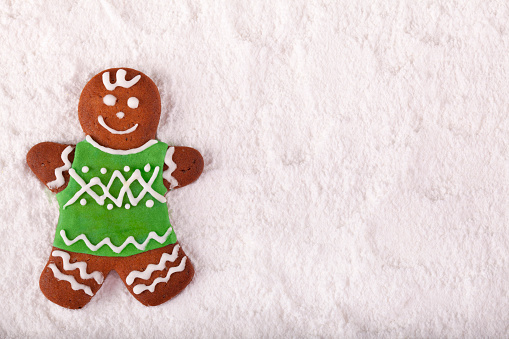 Christmas cookie gingerbread man on snow