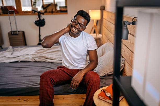 istock Man feeling fresh after a good night sleep 1358626803