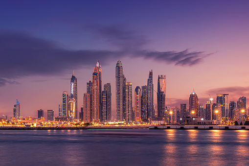 Sunset view of Dubai Marina and famous Jumeirah beach skyline  Emirates