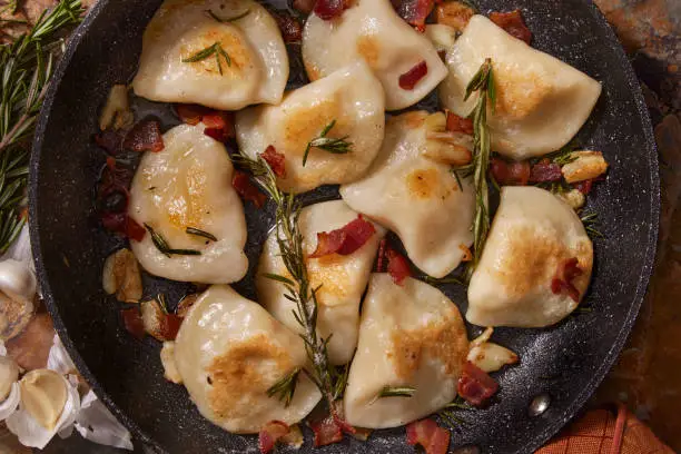 Roasted Garlic Cheddar Pierogi's with Rosemary Butter and Bacon