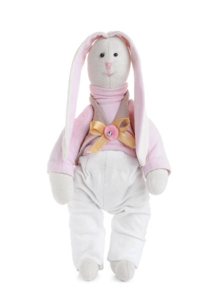 istock Cute soft toy bunny isolated on white 1358629603