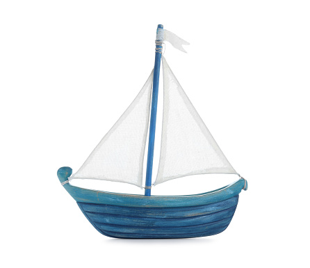 Blue sailboat isolated on white. Child's toy