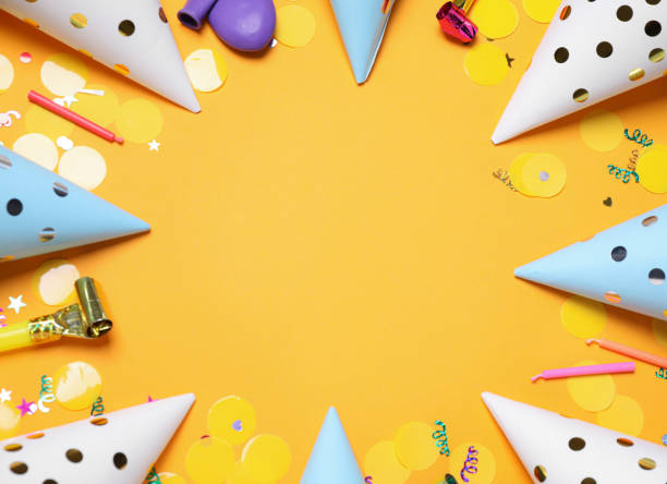 istock Frame of party items on orange background, flat lay. Space for text 1358630753