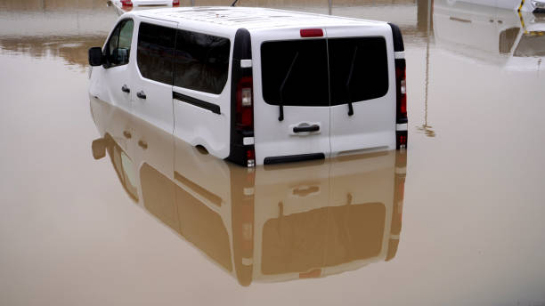 istock big white car sinking in water 1358631980