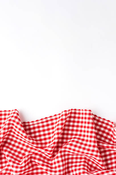 Overhead shot of red checkered table cloth with copyspace stock photo