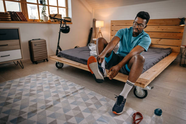 istock Man wearing shoes preparing for workout 1358633532