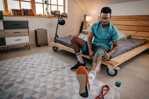 istock Man wearing shoes preparing for workout 1358633641