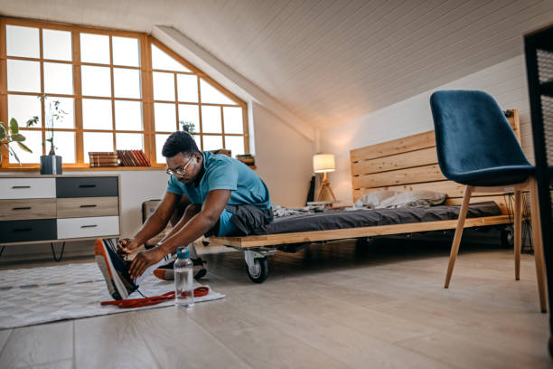 istock Man wearing shoes preparing for workout 1358633703