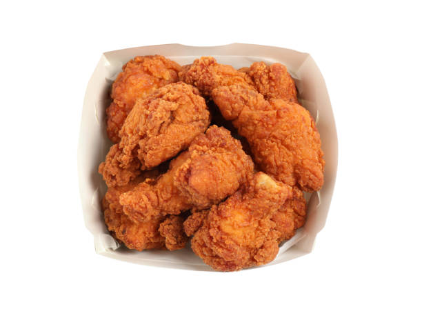 istock Tasty deep fried chicken pieces isolated on white, top view 1358634865