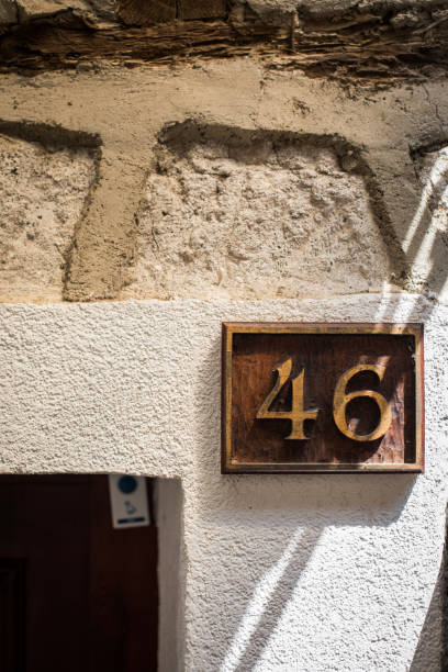 istock Number 46 plaque on a house wall 1358635224