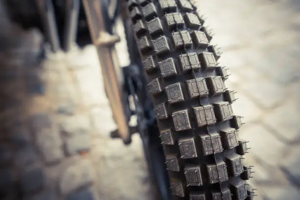 Close up shot of a motocross motorcycle enduro knobby tire.