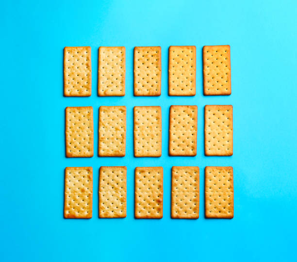istock Delicious crackers on light blue background, flat lay 1358636597