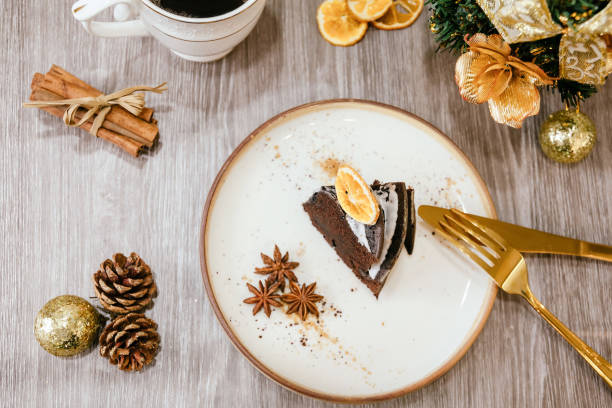 istock Christmas pudding, fruit cake with cup of tea. Traditional festive dessert. Copy space. 1358636761