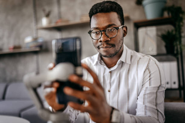 Man preparing smart phone for recording vlog