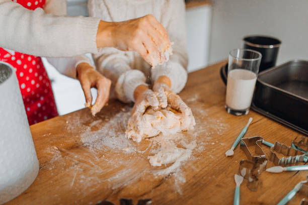 istock Mom and daughter baking cakes in her kitchen 1358640526