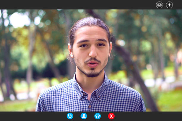 Young bearded man broadcasting live. Connecting live by video calling.