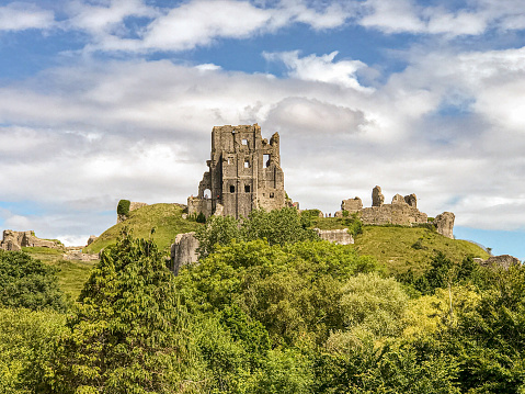 The ruins of Corfe castle in the village with the same name i.e Corfe Castle in Dorset, UK