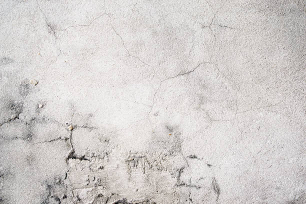istock Beige gray stucco cracked wall texture background 1358644512