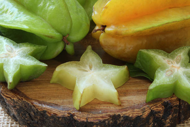 istock Tasty carambola fruit on wooden table. 1358645272