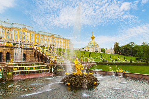 Petergof, Saint Petersburg, Russia - 12 August, 2020: View on Samson fountain and Grand Cascade of Peterhof Palace in sunny summer day
