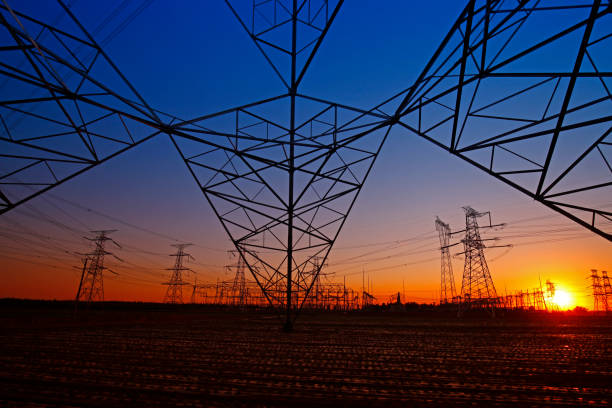 istock Pole and tower of high voltage 1358648027