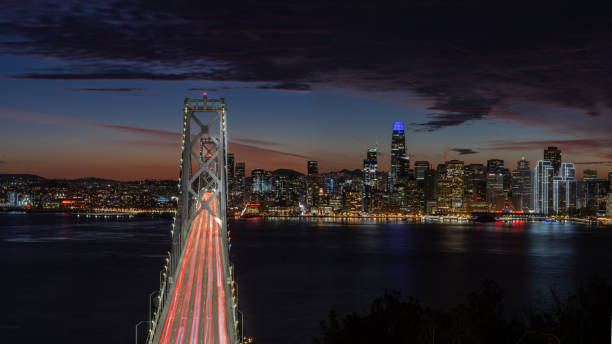istock Bay Bridge and skyline at sunset panorama 1358649008