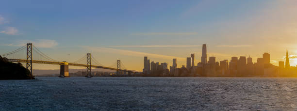 istock Bay Bridge and skyline at sunset panorama 1358649014