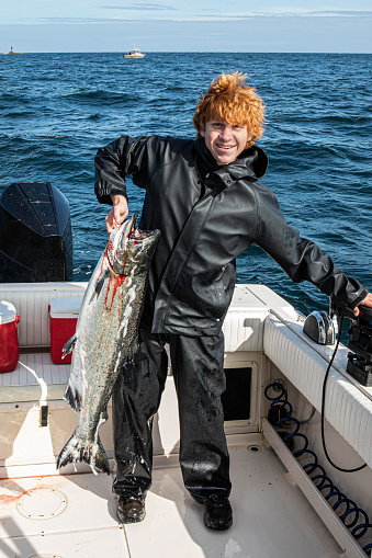 A proud teenager with the first Chinook salmon (King Salmon) he has ever caught. (23 pounds) The salmon was caught at the north end of Graham Island, Haida Gwaii (Queen Charlotte Islands), British Columbia, Canada.