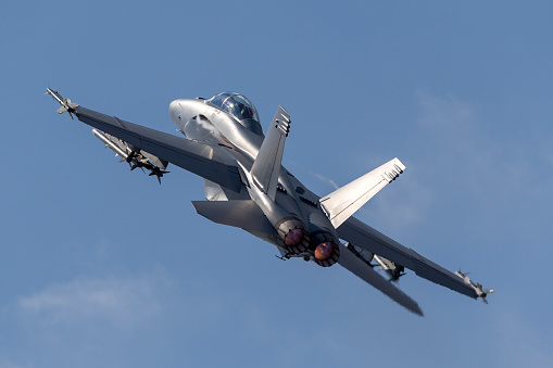 Farnborough, UK - July 16, 2014: United States Navy Boeing F/A-18F multirole fighter aircraft departing Farnborough Airport.