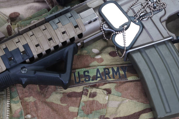 istock US ARMY uniform with dog tags and weapon 1358652658