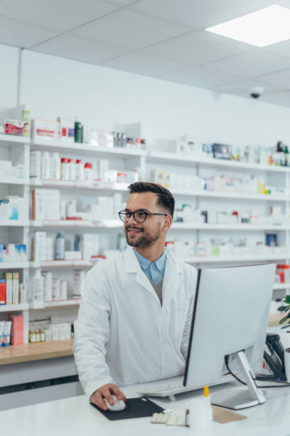 istock Portrait of a handsome pharmacist working in a pharmacy 1358654194