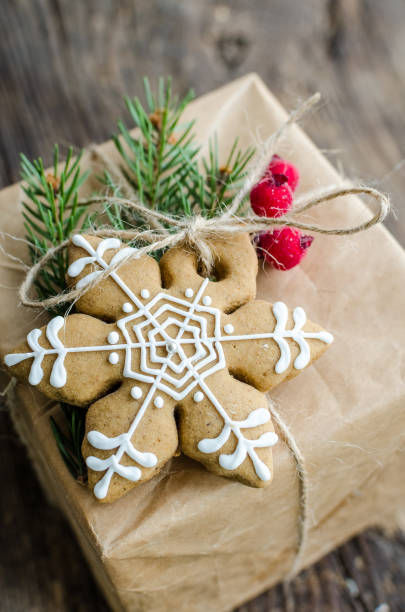 istock Christmas present decorated with gingerbread cookie 1358655318