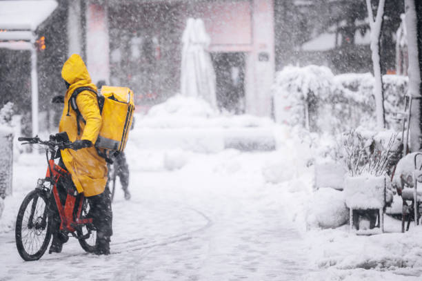 istock Delivery man on a bike 1358658150