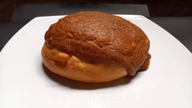 istock Coffee bun or mexican bun on white plate 1358661491