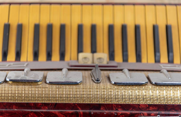 istock Old red accordion covered with dust 1358665077