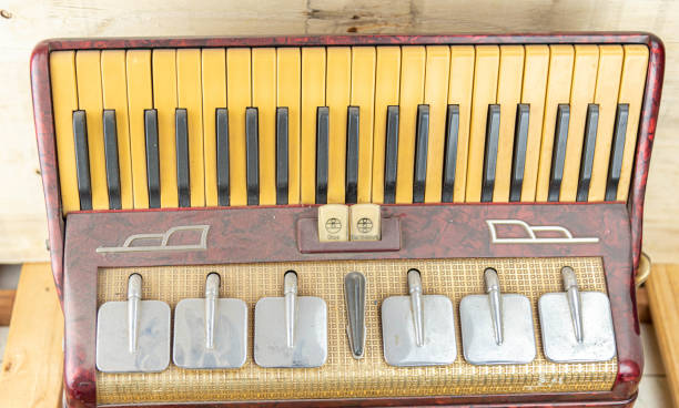 istock Old red accordion covered with dust 1358665091
