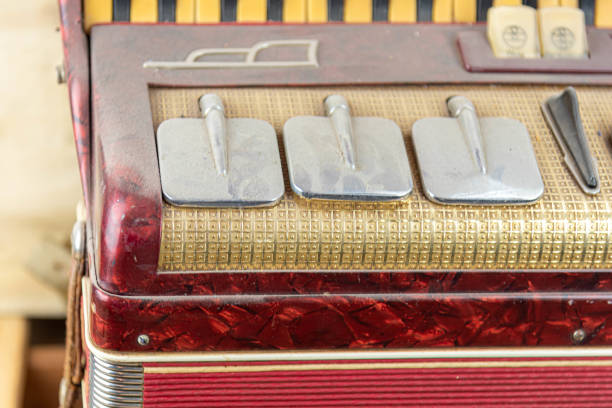 istock Old red accordion covered with dust 1358665099