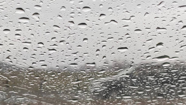 istock Natural background with raindrops on the glass 1358665110