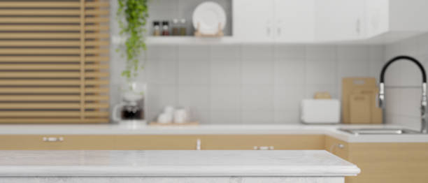 istock Scandinavian kitchen interior design with marble kitchen island 1358666569