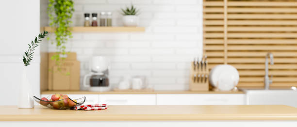 istock Copy space on wooden kitchen countertop over cooking space 1358666599