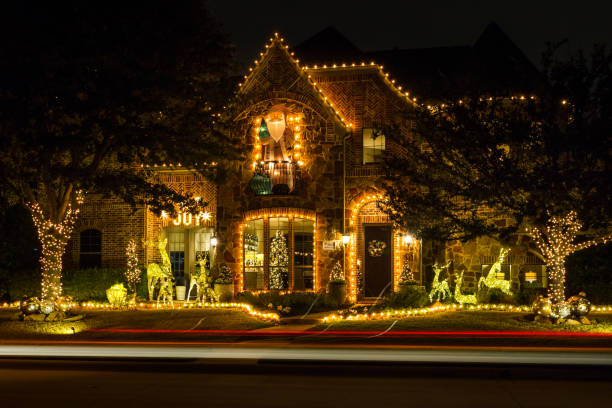 Private residence house in Dallas, Texas, decorated and illuminated for Christmas Allen, Texas, USA - December 16th, 2021: Private residence house decorated and illuminated for Christmas christmas lights house stock pictures, royalty-free photos & images